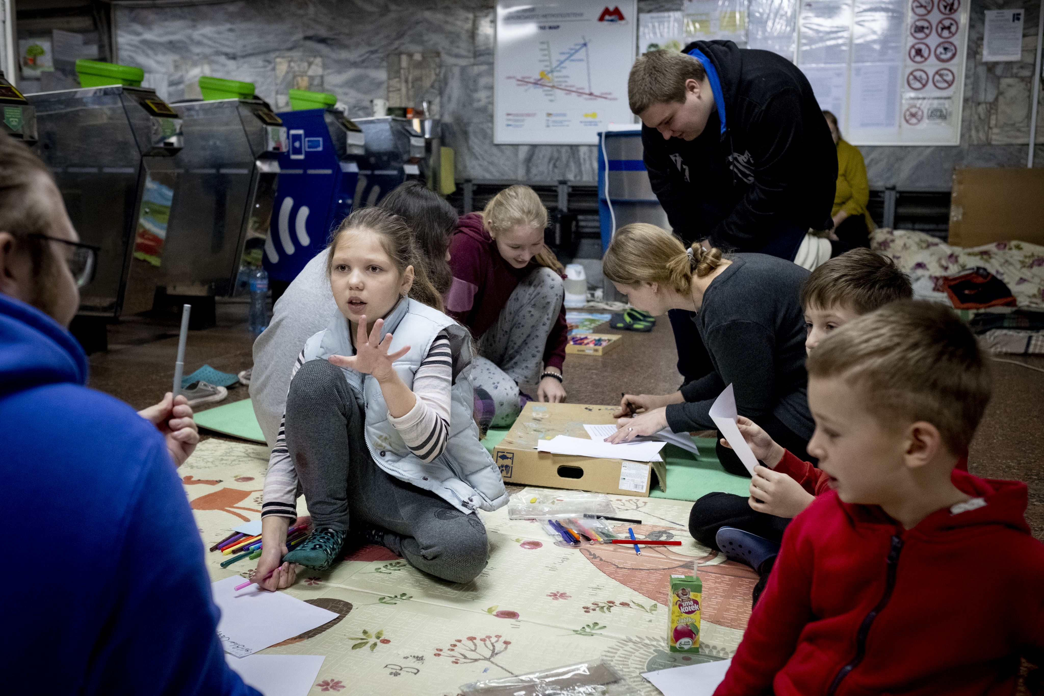 Viktoriia participates in an English language class in a subway station.